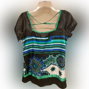 Pretty cap sleeve satiny blouse with criss cross back detail.  Side zipper.